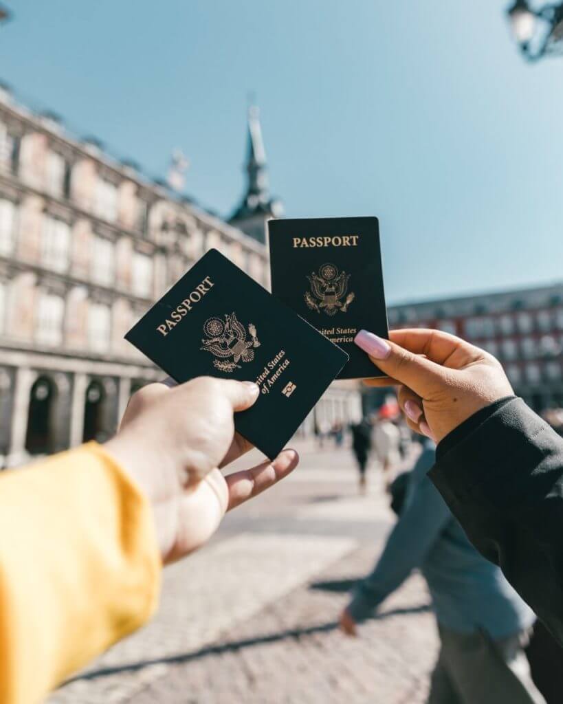 a couple holding U.S. passport.