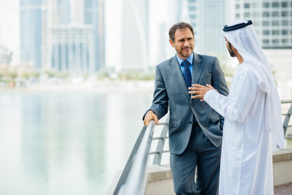 An employee in a meeting with a UAE national. 